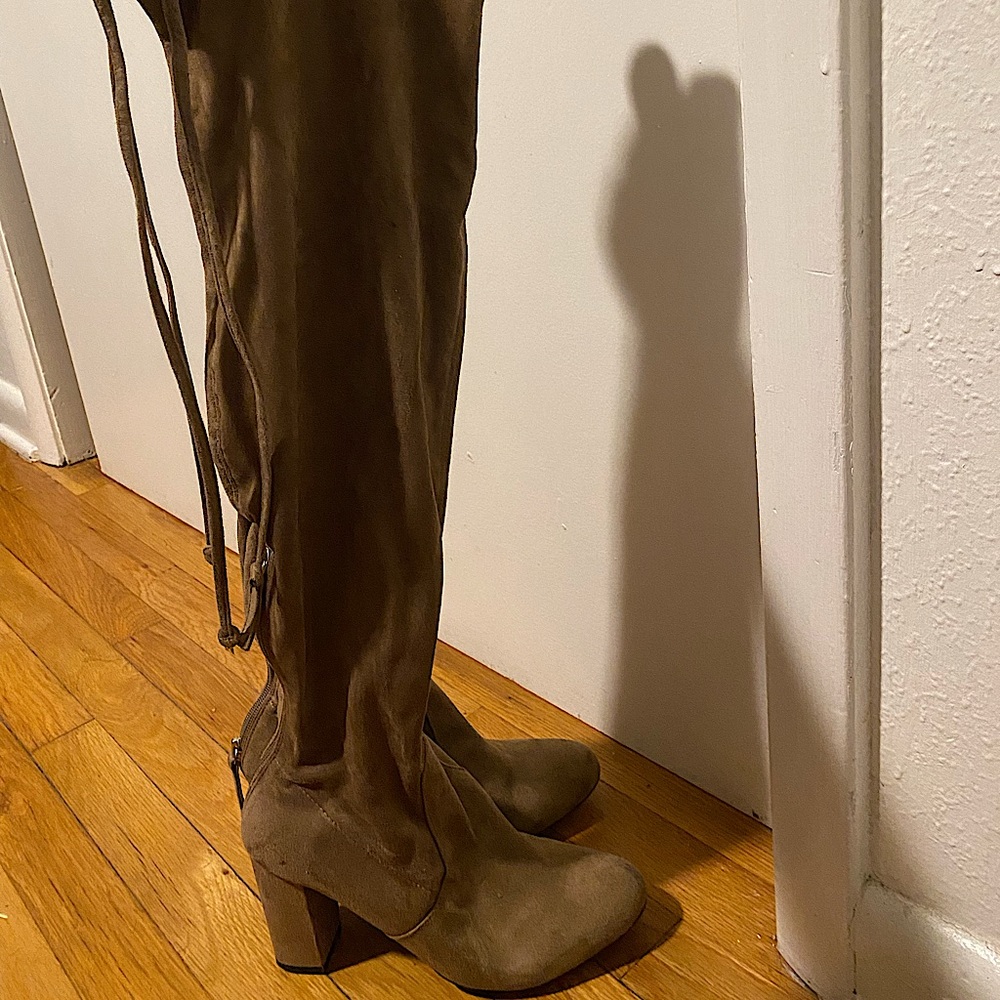 Light brown/tan thigh high boots. Lightly worn.
